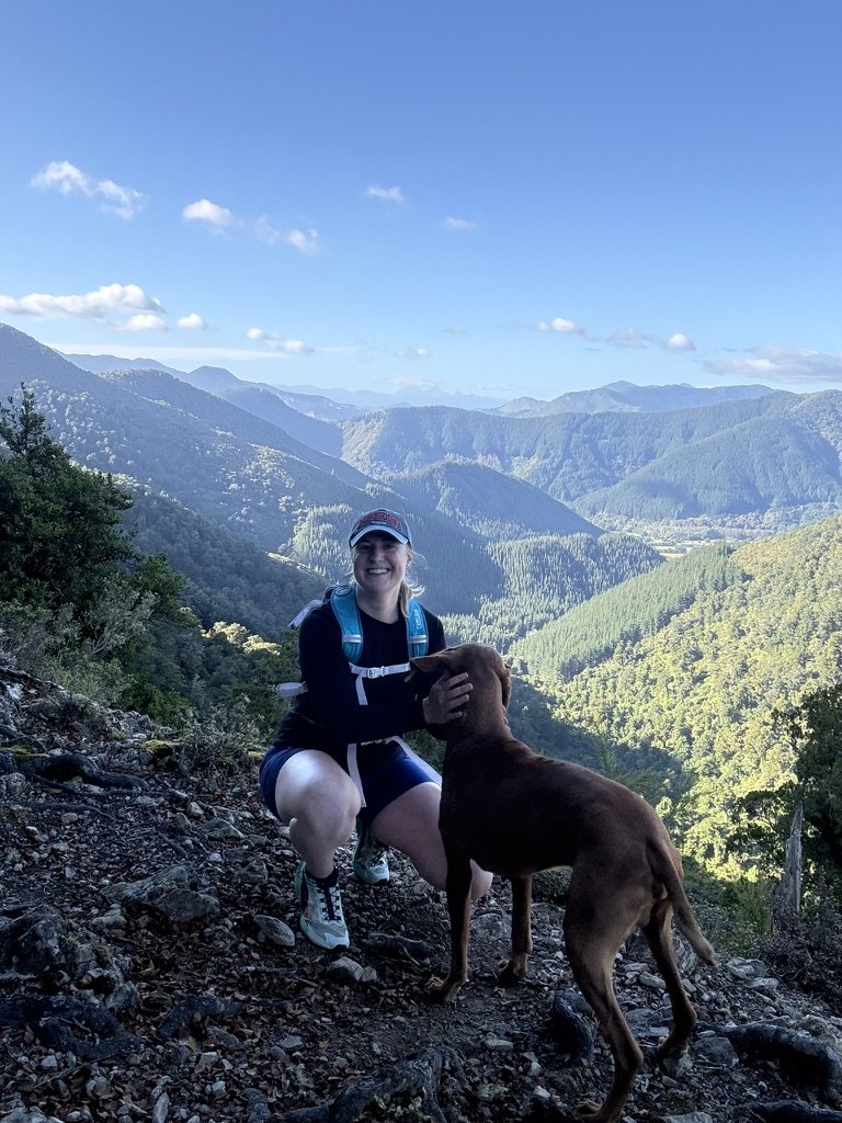 Lucy Hayes hiking with her dog